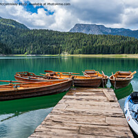 Buy canvas prints of Rowing boats on the Black Lake in Montenegro by Angus McComiskey