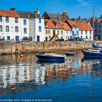 Buy canvas prints of Colourful reflections in St Monans harbour by Angus McComiskey