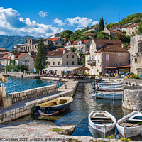 Buy canvas prints of Sheltered harbour at Perast in Montenegro by Angus McComiskey