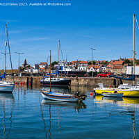 Buy canvas prints of Colourful Boats moored in St Monans harbour by Angus McComiskey