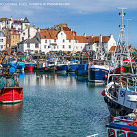 Buy canvas prints of Fishing fleet tied up in Pittenweem harbour by Angus McComiskey