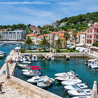 Buy canvas prints of Waterfront of Hvar town, Croatia by Angus McComiskey