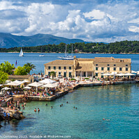 Buy canvas prints of Faliraki bathing beach Corfu old town, Greece by Angus McComiskey