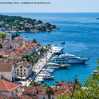 Buy canvas prints of Boats on Riva waterfront in Hvar town, Croatia by Angus McComiskey