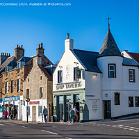 Buy canvas prints of The Ship Tavern on seafront of Anstruther in Fife by Angus McComiskey
