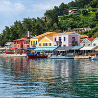 Buy canvas prints of Colourful waterfront of Katakolon, Greece by Angus McComiskey