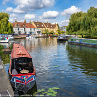 Buy canvas prints of Barges moored on the River Great Ouse at Ely by Angus McComiskey