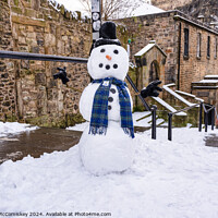 Buy canvas prints of The Vennel snowman, Edinburgh Old Town by Angus McComiskey