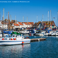 Buy canvas prints of Boats moored in Anstruther marina in Fife by Angus McComiskey
