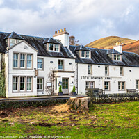 Buy canvas prints of Loch Lomond Arms Hotel in Luss, Scotland by Angus McComiskey