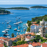 Buy canvas prints of Aerial view of Hvar town and harbour, Croatia by Angus McComiskey