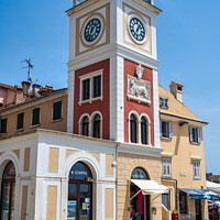 Buy canvas prints of Clock Tower in old town of Rovinj, Croatia by Angus McComiskey