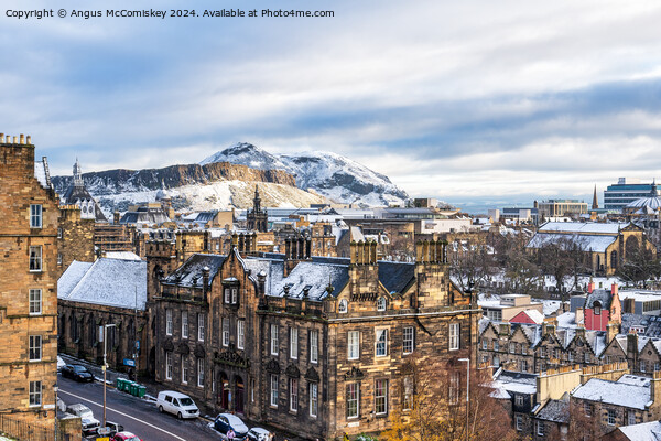 Salisbury Crags and Edinburgh skyline in snow Picture Board by Angus McComiskey
