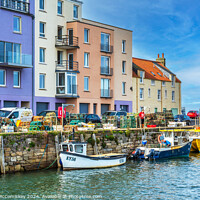 Buy canvas prints of Colourful quayside buildings on St Andrews harbour by Angus McComiskey