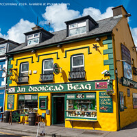 Buy canvas prints of Traditional Irish Pub in Dingle Town, County Kerry by Angus McComiskey