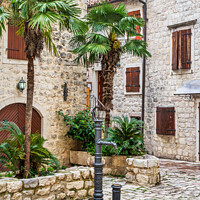 Buy canvas prints of Drinking water tap in old town of Kotor Montenegro by Angus McComiskey