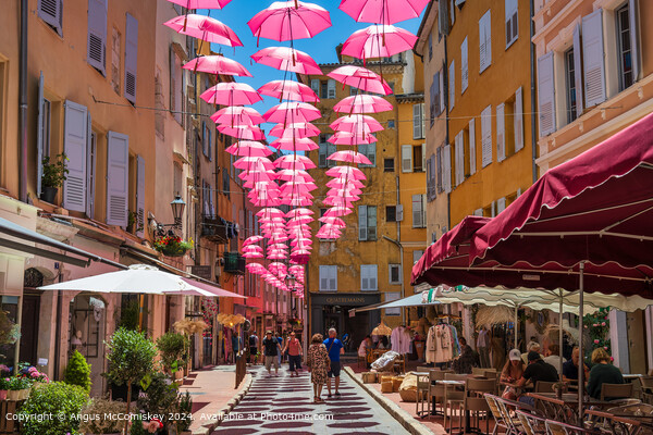 Pink umbrellas in old town Grasse, French Riviera Picture Board by Angus McComiskey
