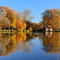 Buy canvas prints of Boathouse on Penicuik Pond in autumn by Angus McComiskey