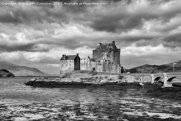 Dramatic sky over Eilean Donan Castle Picture Board by Angus McComiskey