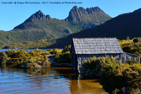 Boat shed with backdrop of Cradle Mountain Picture Board by Angus McComiskey
