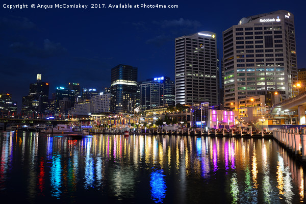 Darling Harbour by night Picture Board by Angus McComiskey