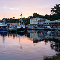 Buy canvas prints of Boats in Strahan seafront Tasmania by Angus McComiskey