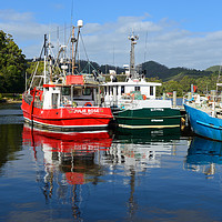 Buy canvas prints of Fishing boat reflections Strahan harbour Tasmania by Angus McComiskey