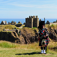 Buy canvas prints of Piper at Dunnottar Castle by Angus McComiskey