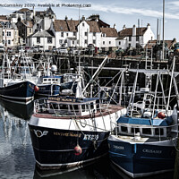 Buy canvas prints of Fishing boats moored in Pittenweem Harbour by Angus McComiskey