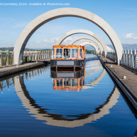 Buy canvas prints of Canal boat leaving Falkirk Wheel by Angus McComiskey