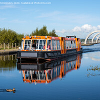 Buy canvas prints of Canal boat leaving Falkirk Wheel behind by Angus McComiskey