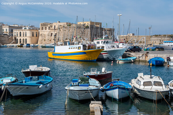 Boats tied up in Gallipoli harbour in Puglia Picture Board by Angus McComiskey