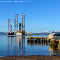 Buy canvas prints of Decommissioned oil rigs off Cromarty harbour by Angus McComiskey