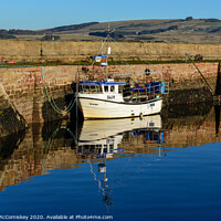 Buy canvas prints of Fishing boat tied up in Cromarty harbour by Angus McComiskey