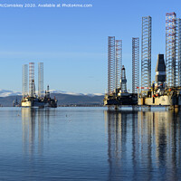 Buy canvas prints of Decommissioned oil rigs in Cromarty Firth by Angus McComiskey