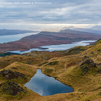 Buy canvas prints of Lochan on the Trotternish ridge, Isle of Skye by Angus McComiskey