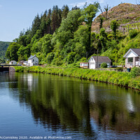 Buy canvas prints of Cairnbaan Village on the Crinan Canal in Scotland by Angus McComiskey