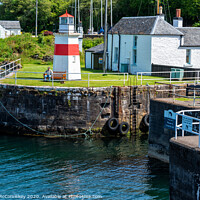 Buy canvas prints of Sea lock and lighthouse on Crinan Canal, Scotland by Angus McComiskey