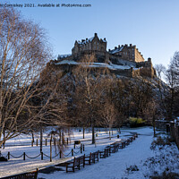 Buy canvas prints of Edinburgh Castle snow from Princes Street Gardens by Angus McComiskey