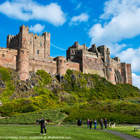 Buy canvas prints of Bamburgh Castle Northumberland by Angus McComiskey