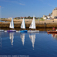 Buy canvas prints of Dinghies returning to Findhorn harbour, Scotland by Angus McComiskey