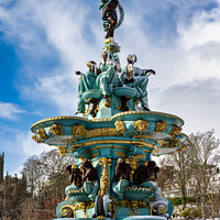 Buy canvas prints of Frozen Ross Fountain in Princes Street Gardens by Angus McComiskey
