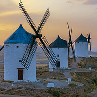 Buy canvas prints of Sunset on the windmills at Consuegra, Spain by Alan Crawford
