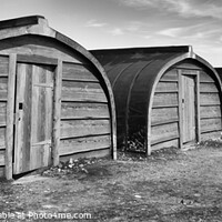 Buy canvas prints of Upturned Boat Sheds on Holy Isle, Northumberland by Alan Crawford