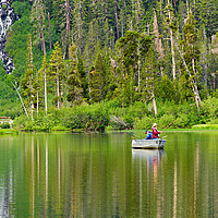 Buy canvas prints of Two people fishing on a lake by Jamie Pham