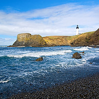 Buy canvas prints of Yaquina Lighthouse on top of rocky beach by Jamie Pham