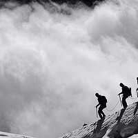 Buy canvas prints of Climbers descending into the clouds by Colin Woods