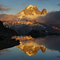 Buy canvas prints of The Aiguille Verte reflected in Lac Blanc by Colin Woods
