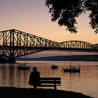 Buy canvas prints of Watching the Sunset on the Pont du Quebec by Colin Woods