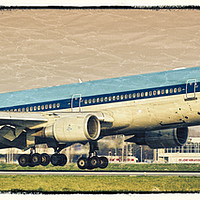 Buy canvas prints of A KLM McDonnell Douglas MD-11 landing at Schiphol  by Colin Woods